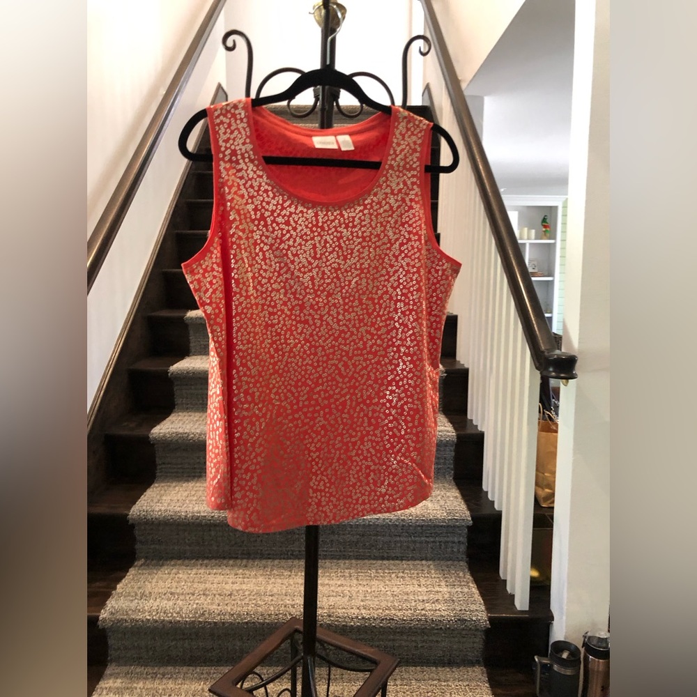 Chico’s size 2. Orange with gold print in front and back.